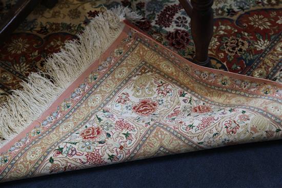 An Isphahan style silk carpet, 9ft 3in by 6ft 4in.